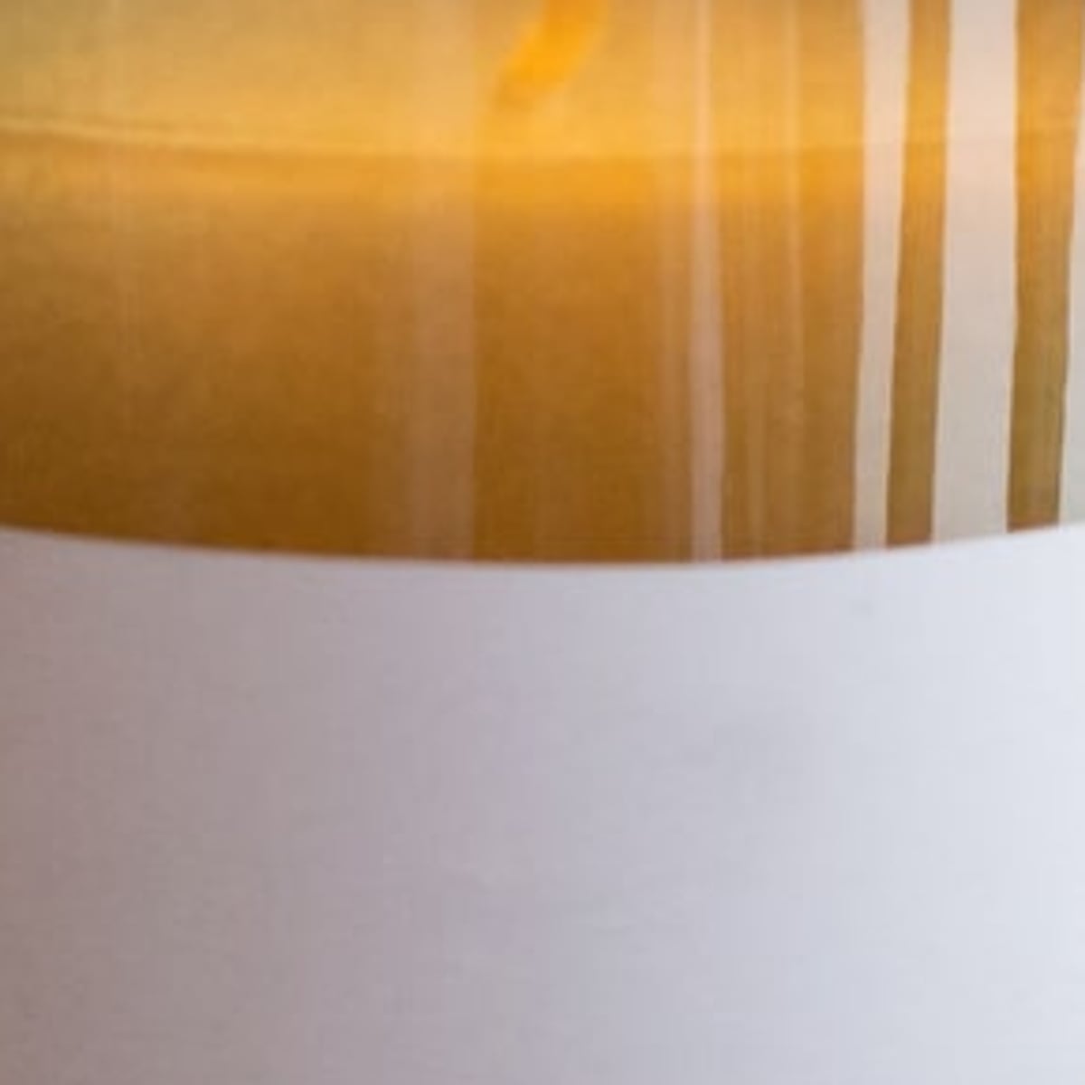Candle in green glass, detail scene