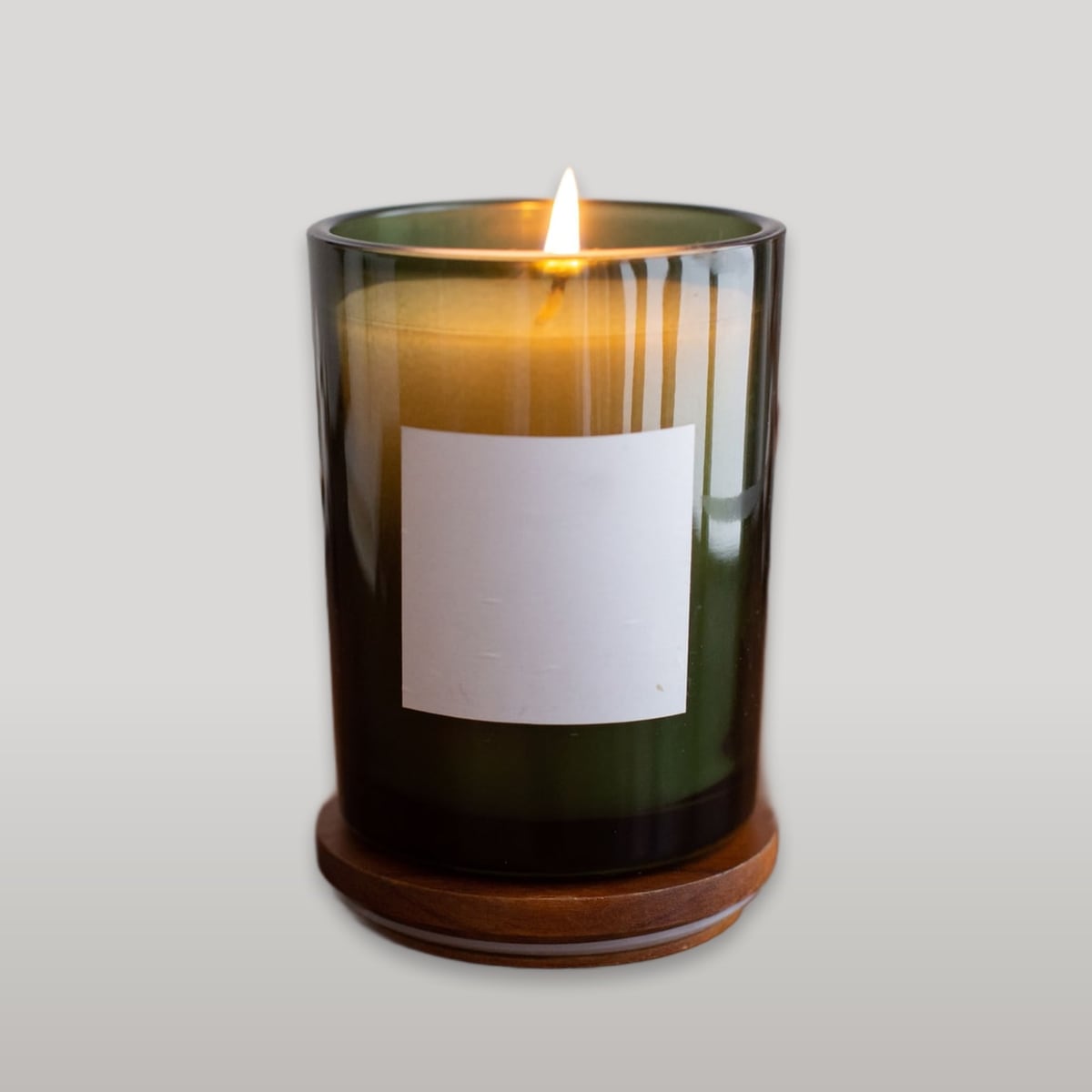 Candle in green glass, studio tone scene
