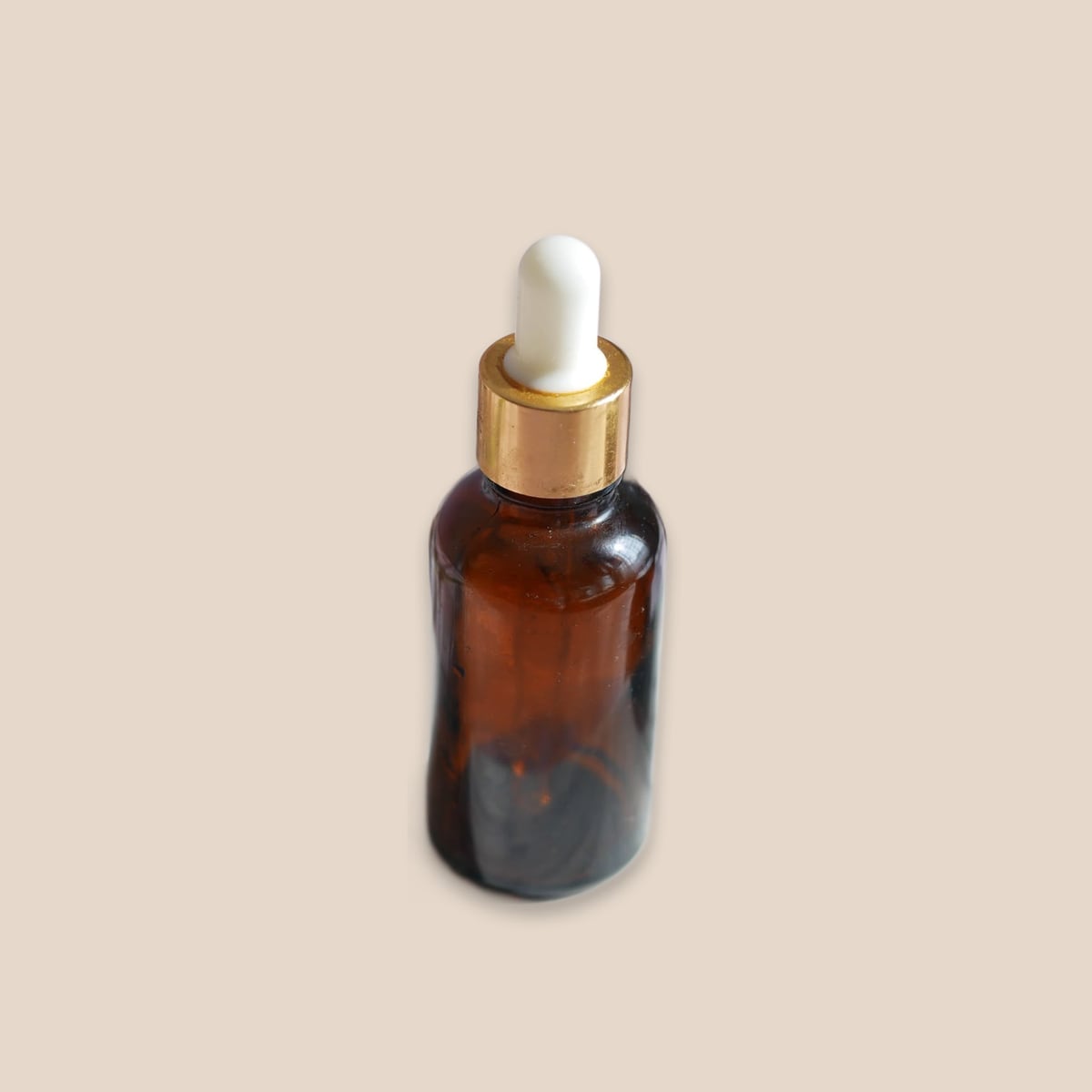 Amber serum bottle, colour field scene